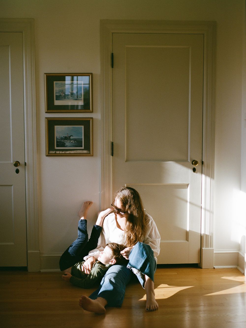 A series of photos showing a person lying on a wooden floor in different positions as sunlight streams through a window.