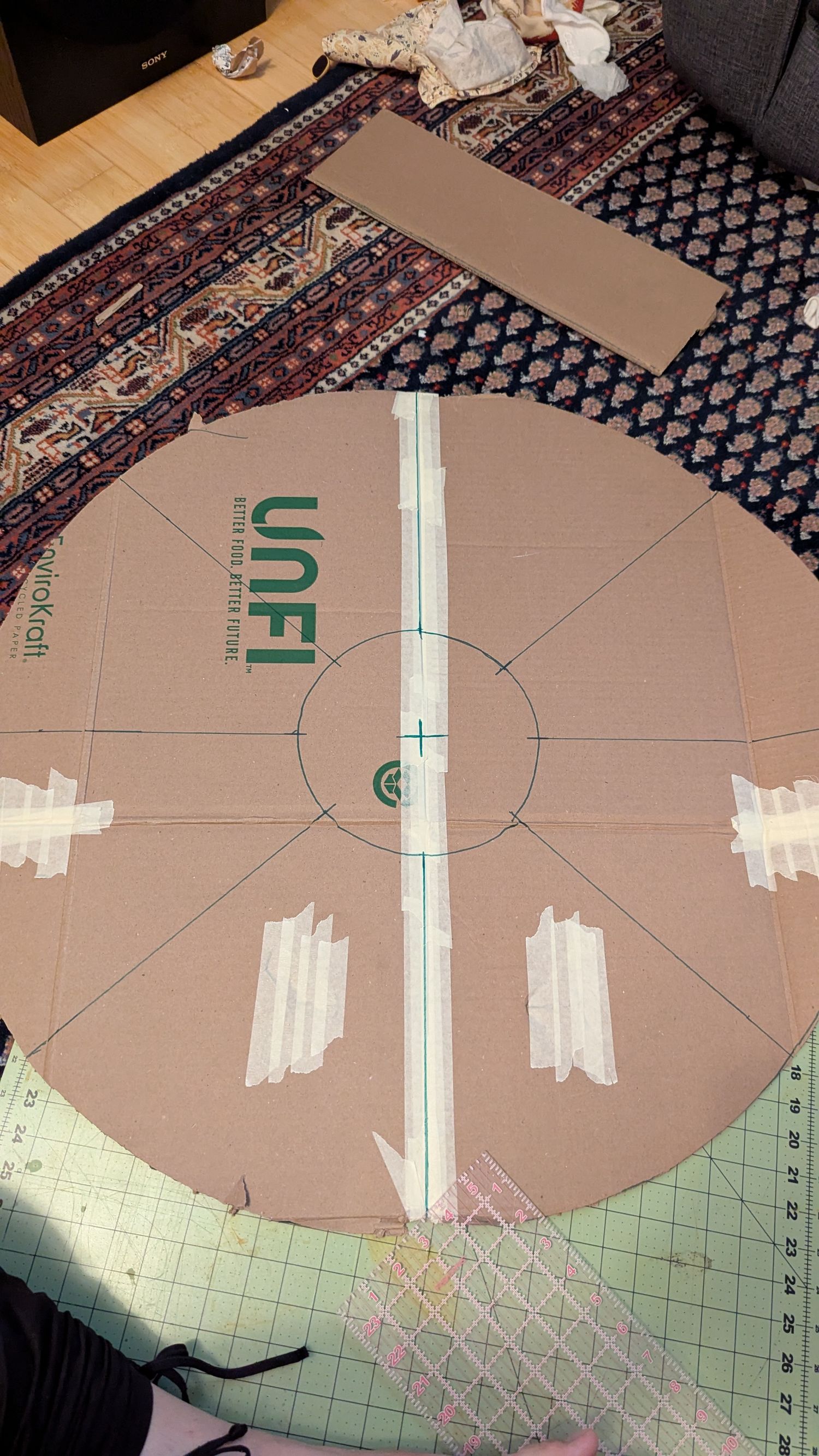 The Circle has increments marked evenly in preparation to be cut.