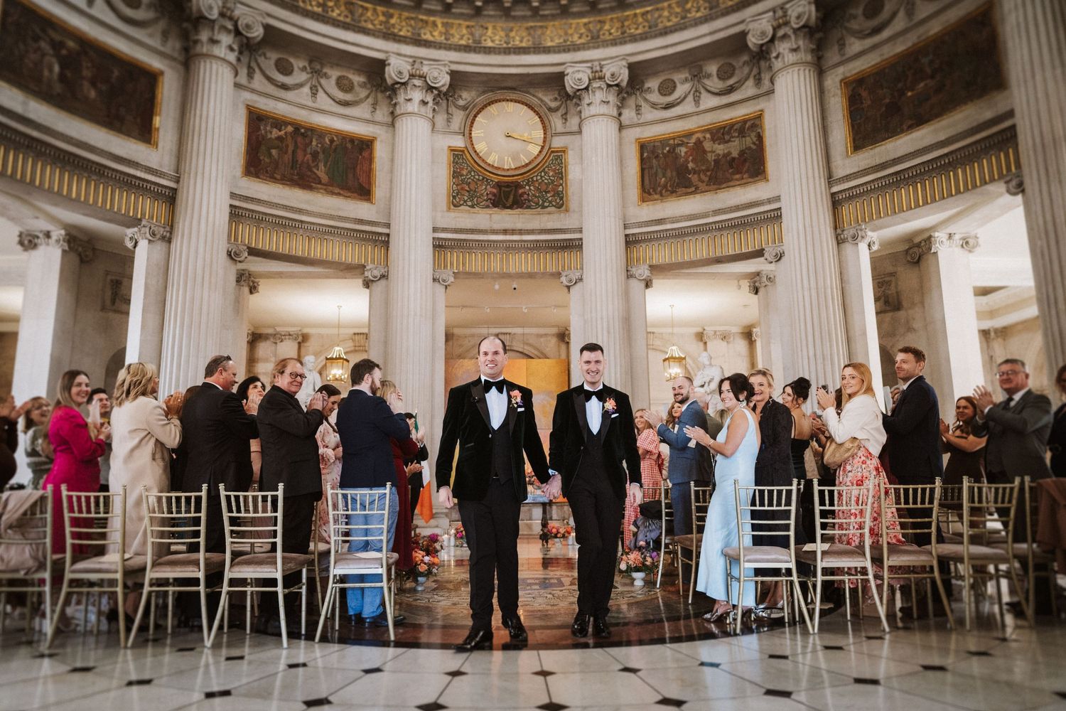 Panoramic view of circular wedding venue with domed ceiling and classical architecture.