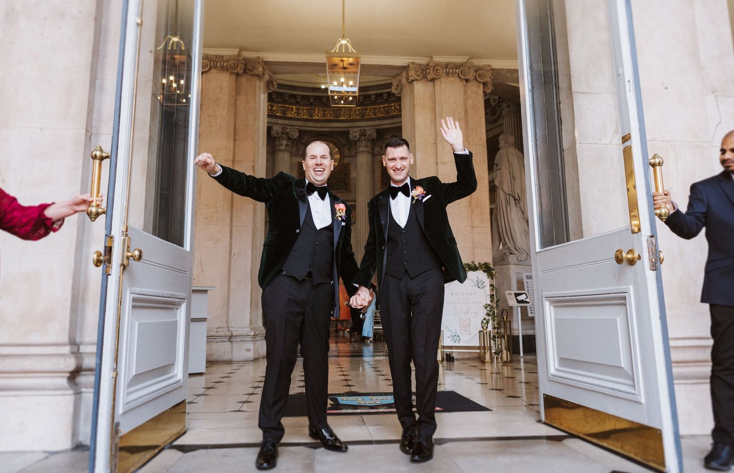 Five sequential photos show a couple celebrating in a grand white hallway with ornate doors and chandeliers.