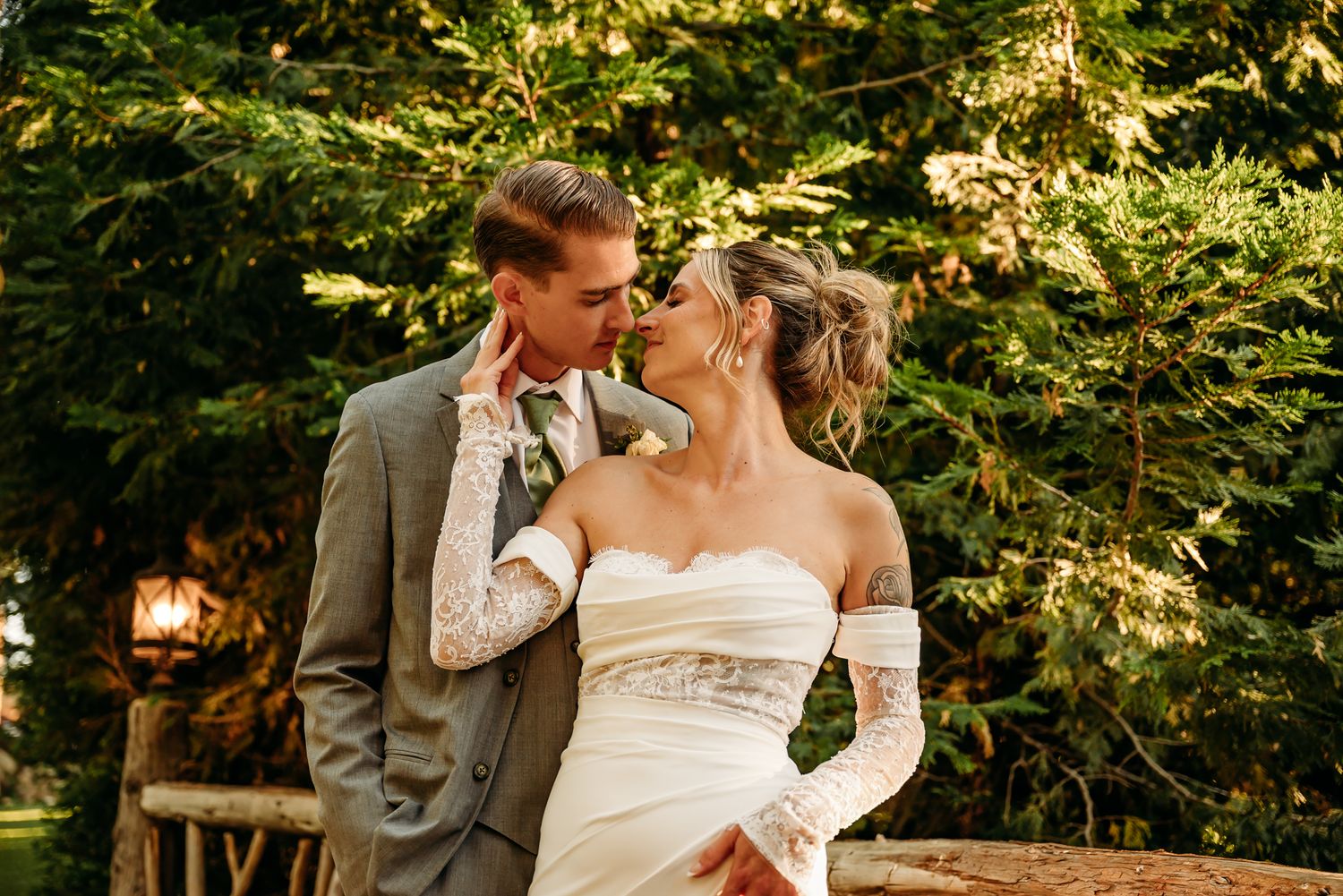 Couple sharing intimate moment during outdoor garden wedding ceremony.