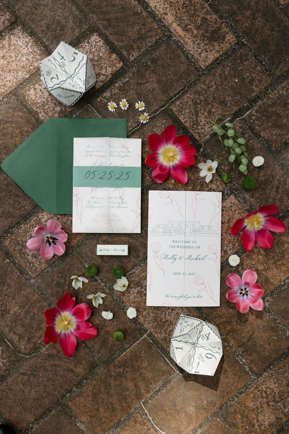 Wedding stationery and pink floral decorations arranged on rustic stone tiles in a progression of layouts.