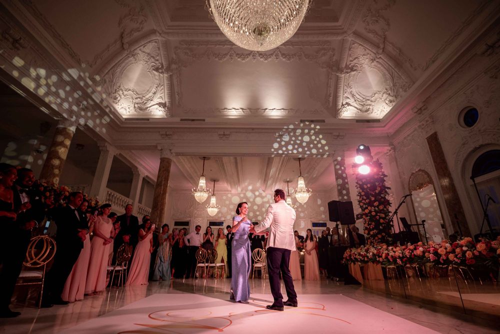 Elegant ballroom dance scene with ornate ceiling details and romantic mood lighting.