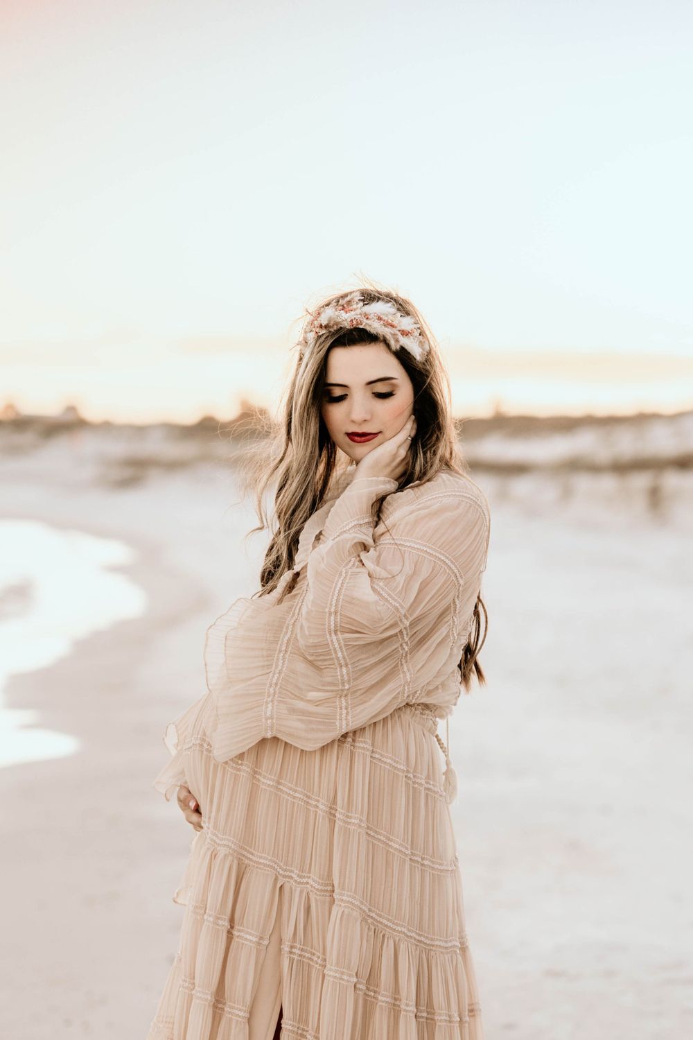 Panama City Beach photographer, family photos PCB, 30A pastel maternity portrait with floral crown against beach sunset.