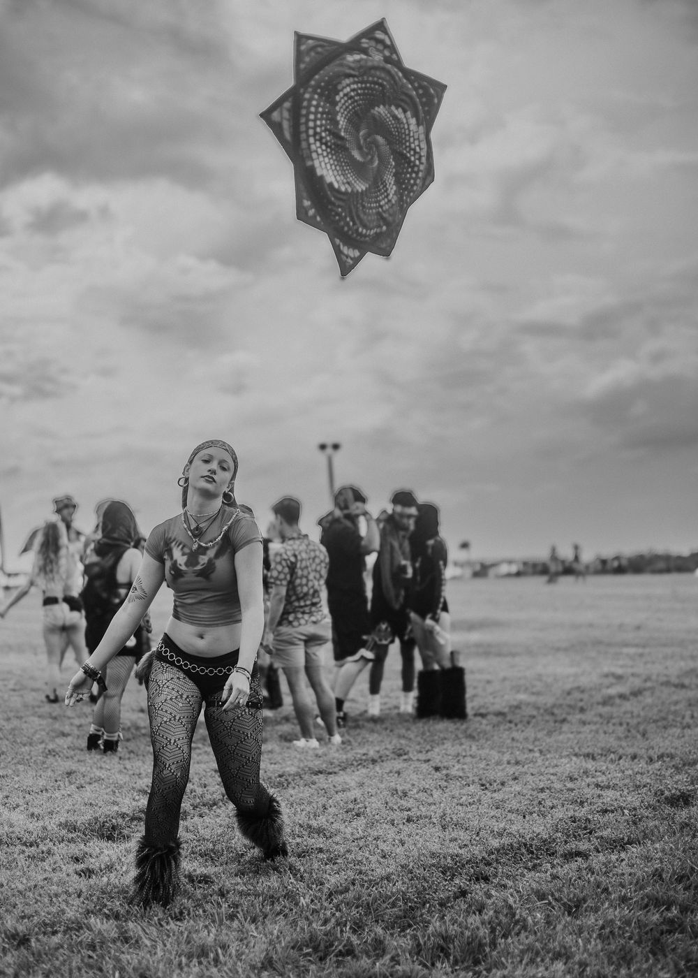 Festival goer with her flow star at a festival