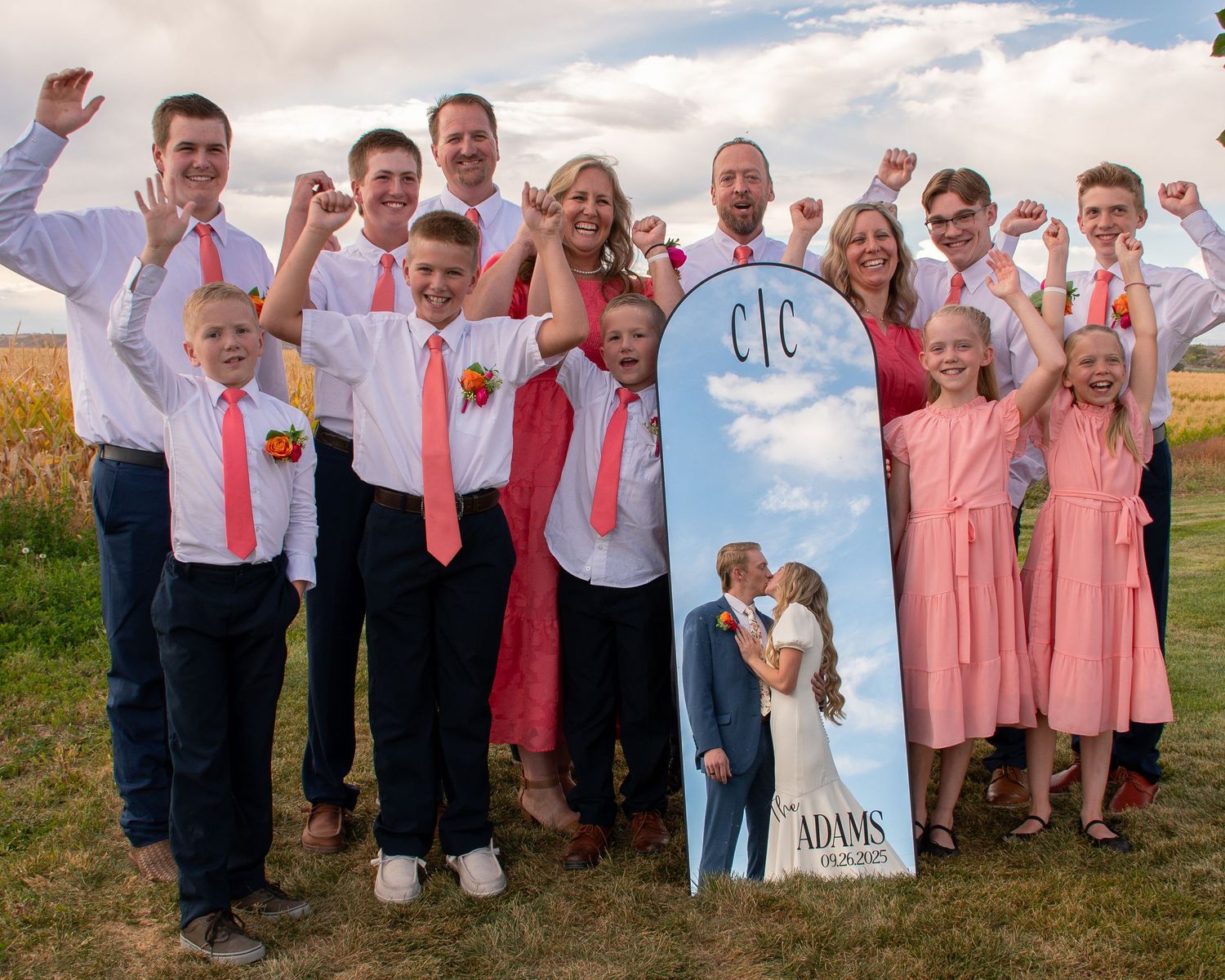 Family celebrates couple on their wedding day on a fun unique photo.