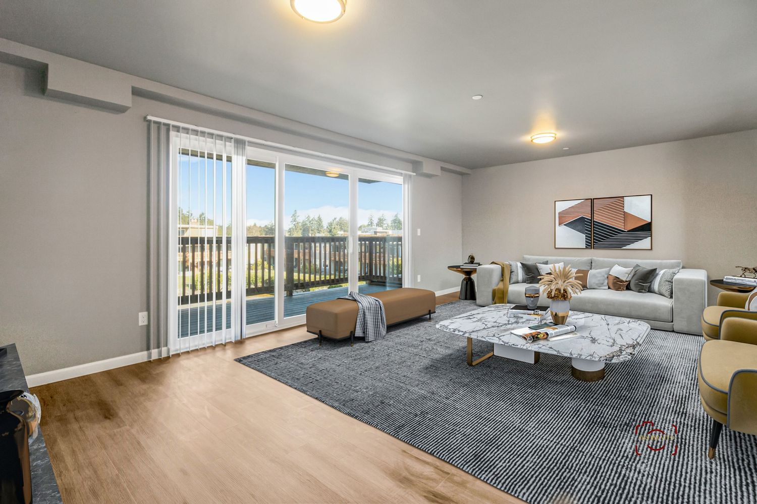 Modern living room with sliding glass doors, grey area rug, and contemporary furniture.