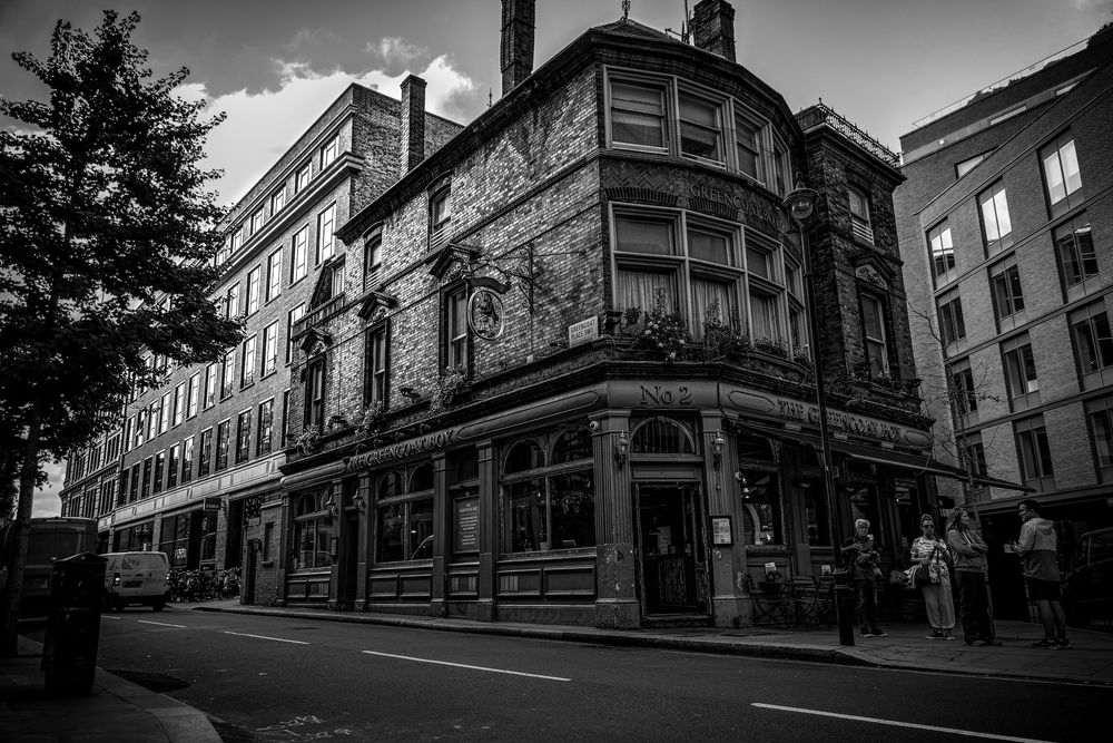 A series of black and white architectural photographs showing historic Quebec City streets and buildings in dramatic angles.