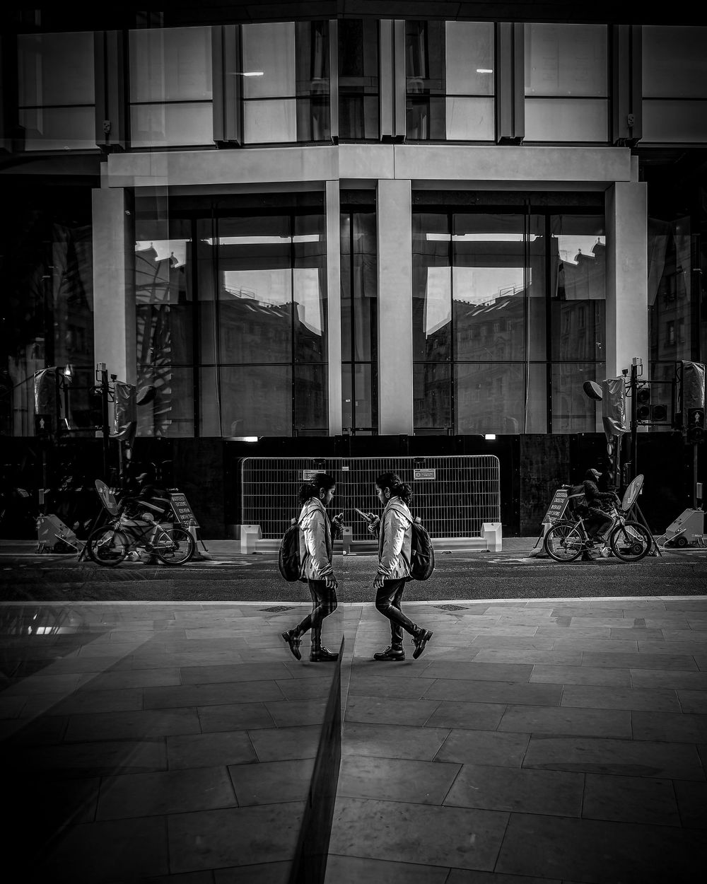 Six black and white urban street photos showing passing shadows and figures against building facades in sequence.