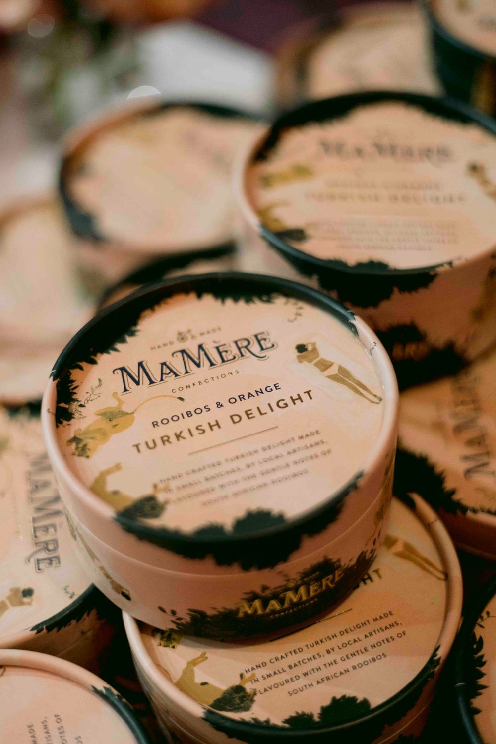 MaMere Rooibos and Orange Turkish Delight confectionery tins stacked at an event.