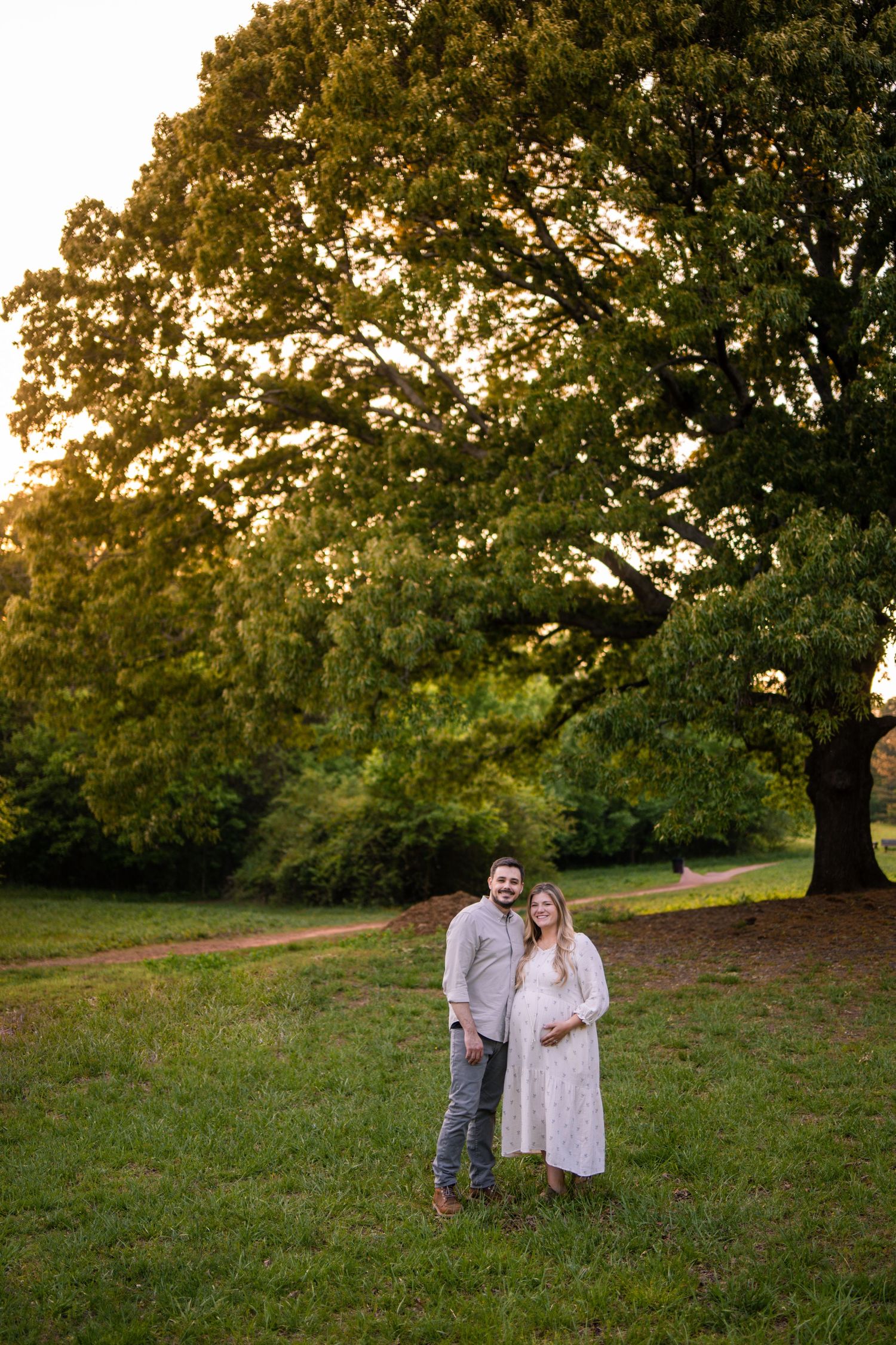 Pregnant wife with husband at a Marietta park maternity session