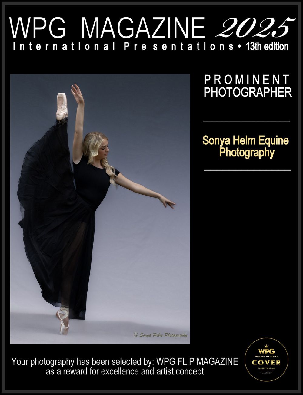 Contemporary dancer in black dress performing expressive pose against gray studio backdrop.