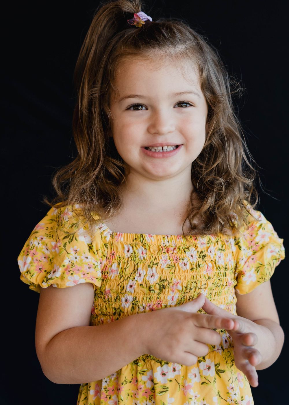 Candid school photo of smiling toddler during daycare photo day in Palm Bay Florida