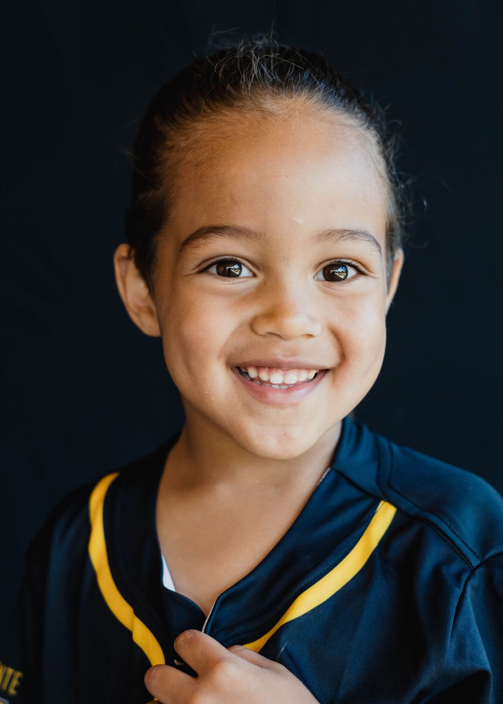 Natural light preschool portrait with soft neutral background in Melbourne Florida