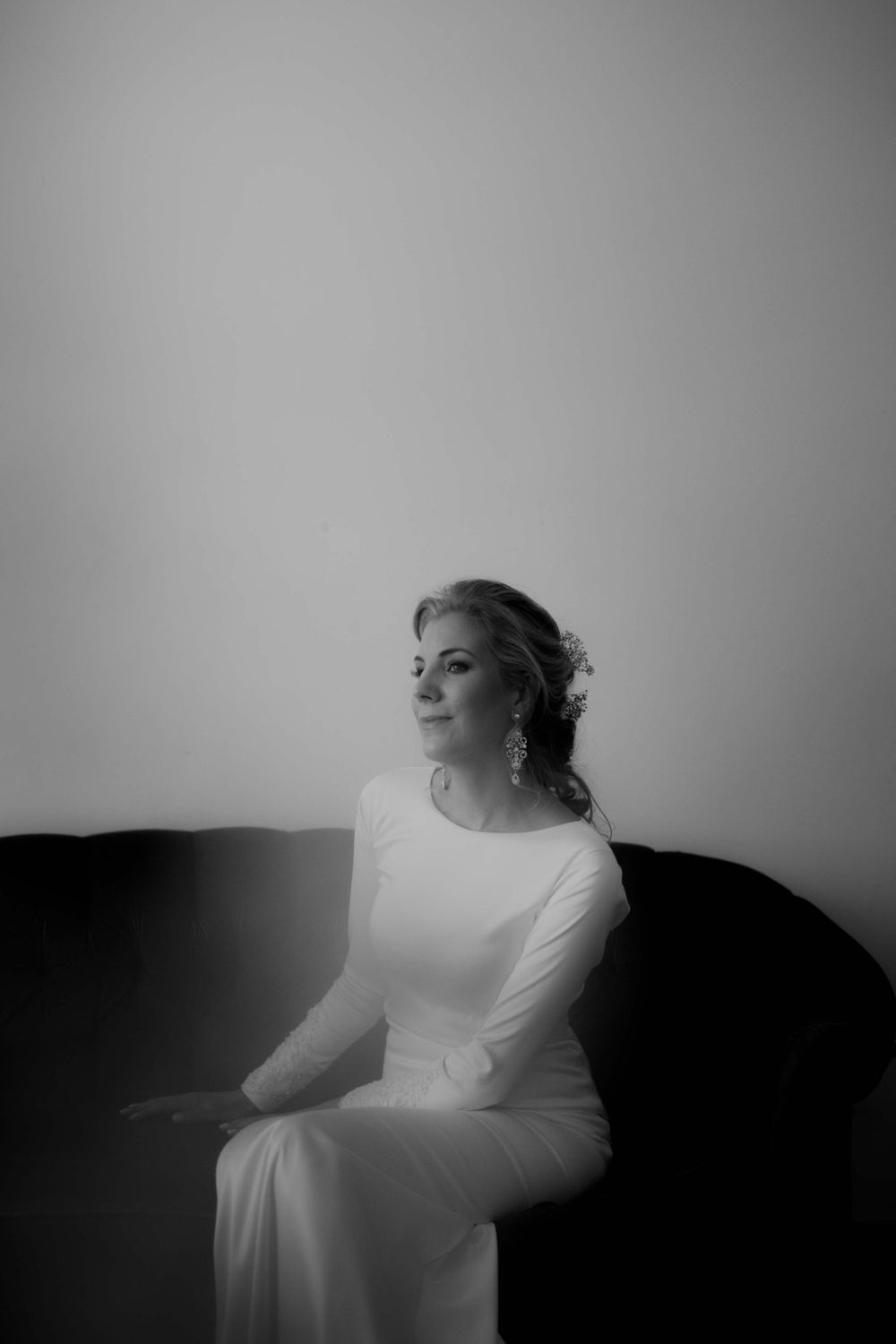 A classic black and white bridal portrait showing elegant simplicity against a minimalist background.
