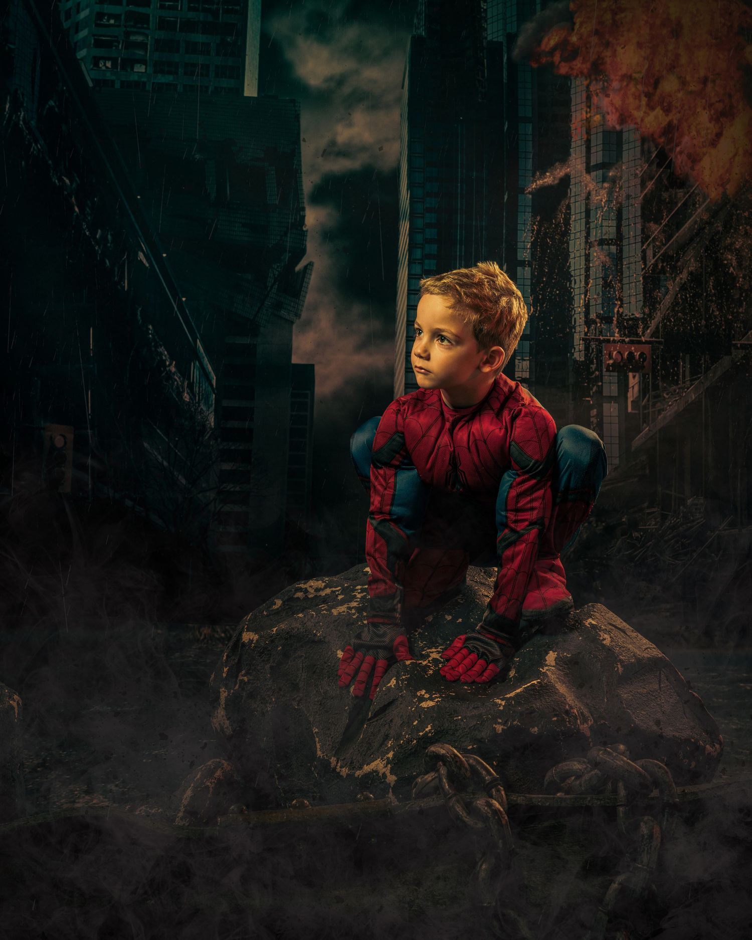 A hero in red and blue crouches on rubble in a dark urban landscape.