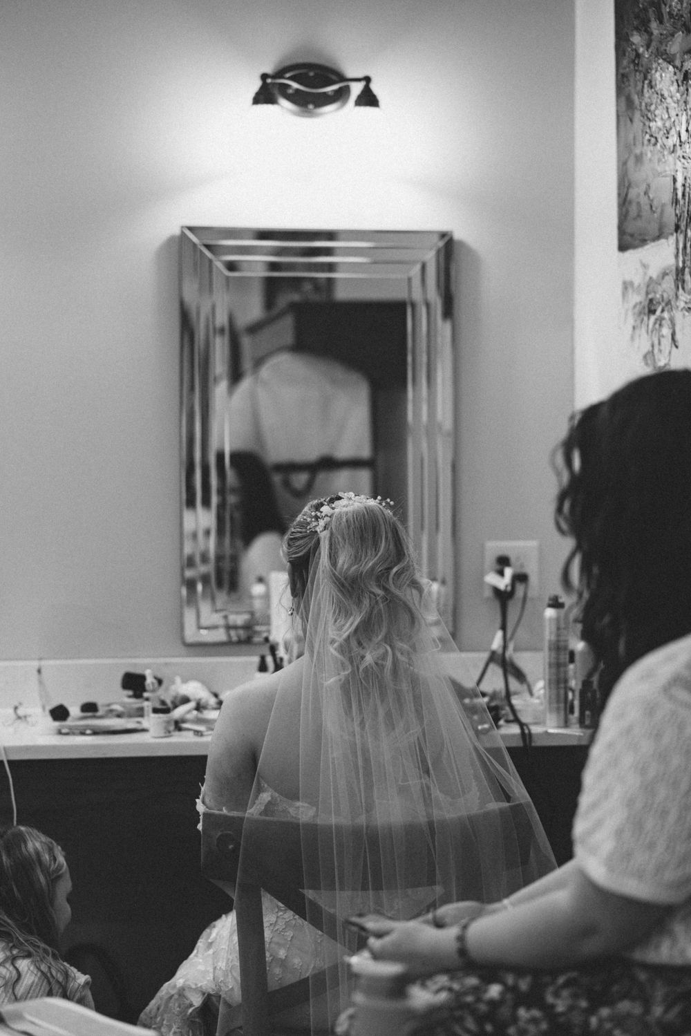 Getting ready scene in bridal suite with veil and mirrors. Estate and historic venue wedding photographer for NC