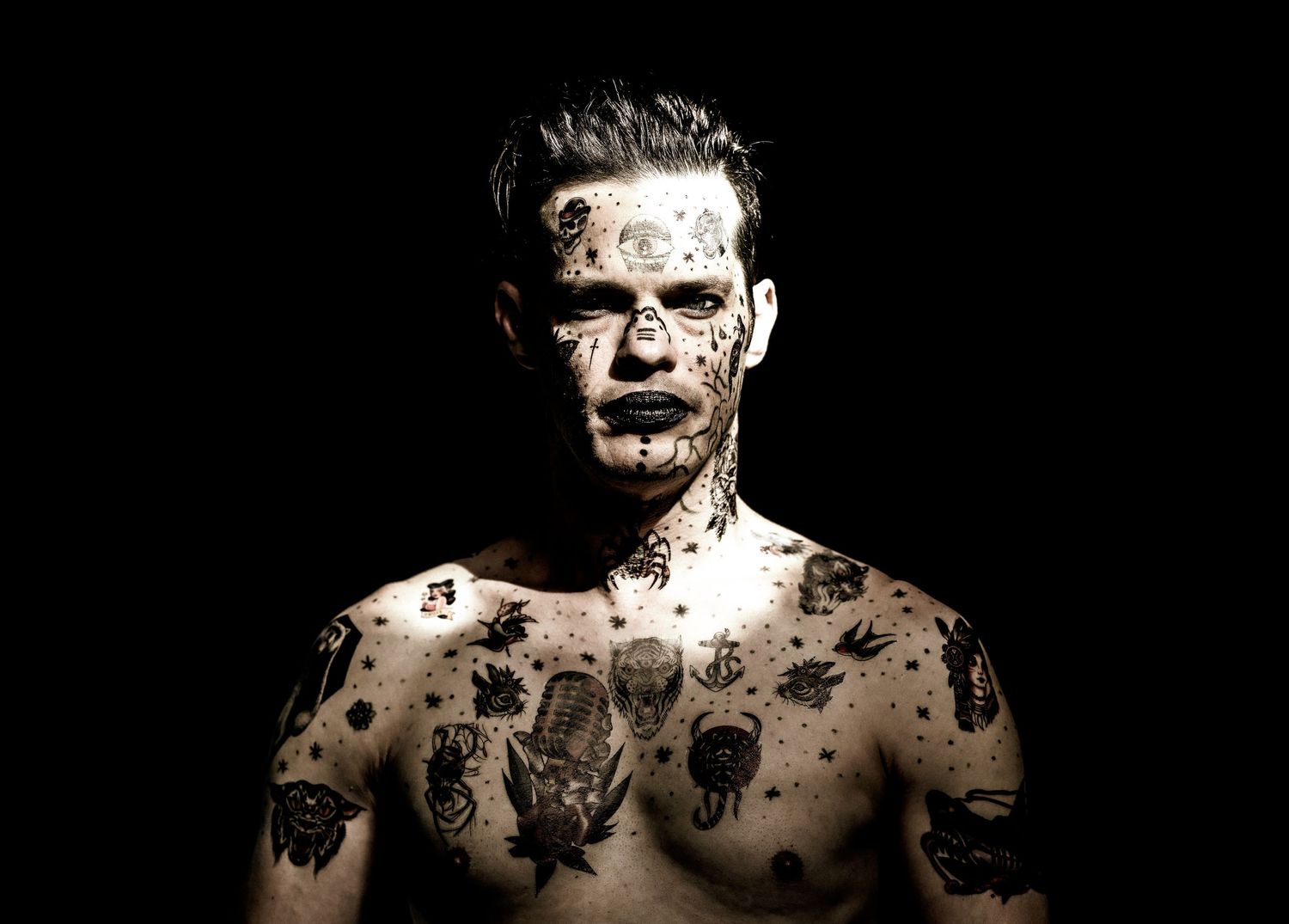 High contrast black and white artistic portrait with dramatic shadows and lighting effects.