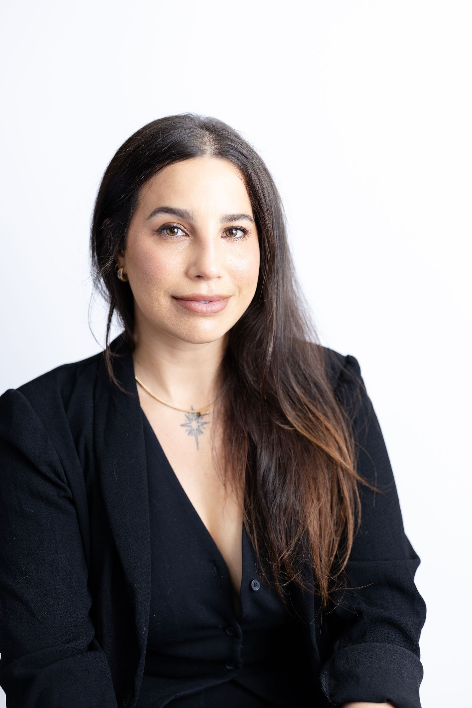 Confident personal brand portrait of professional woman in studio setting. San Diego Photographer