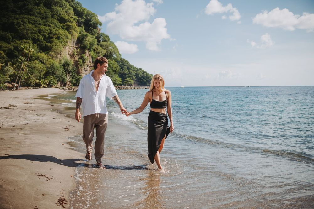 St Lucia Photographer captures surprise Proposal and engagement photoshoot at Anse Mamin Beach near Jade Mountain and Anse Chastenet Hotel