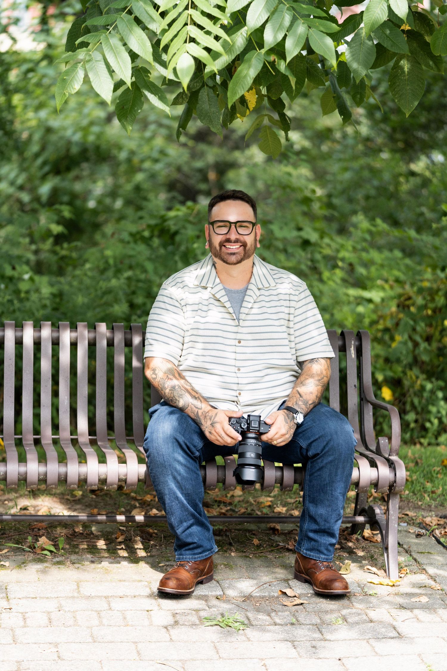 A series of photos showing someone sitting on a wooden bench holding a camera in an outdoor garden setting.