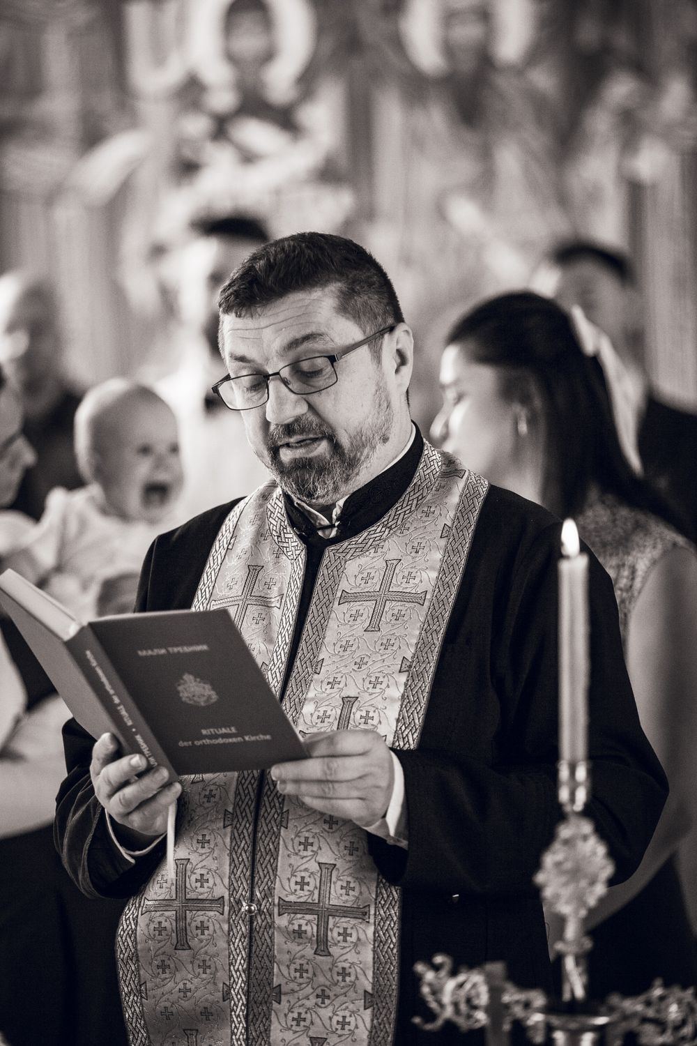 A progression of images shows a clergy member in ornate robes reacting with increasingly expressive emotions while reading.