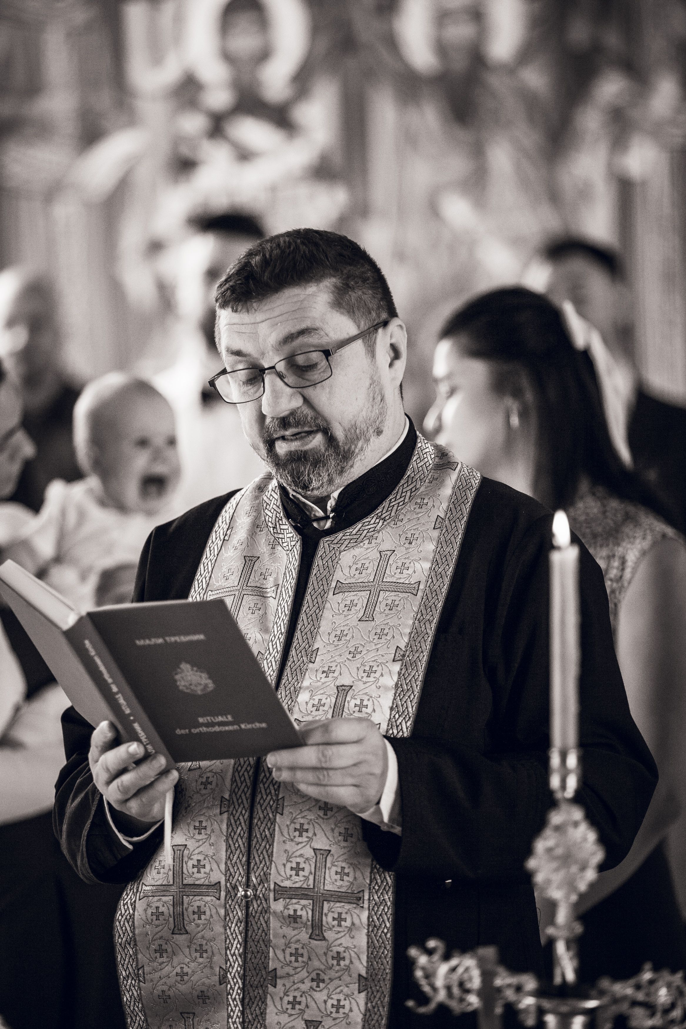 A progression of images shows a clergy member in ornate robes reacting with increasingly expressive emotions while reading.