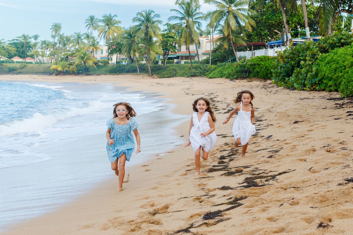 Three girls on the beach in Dorado, Puerto Rico.