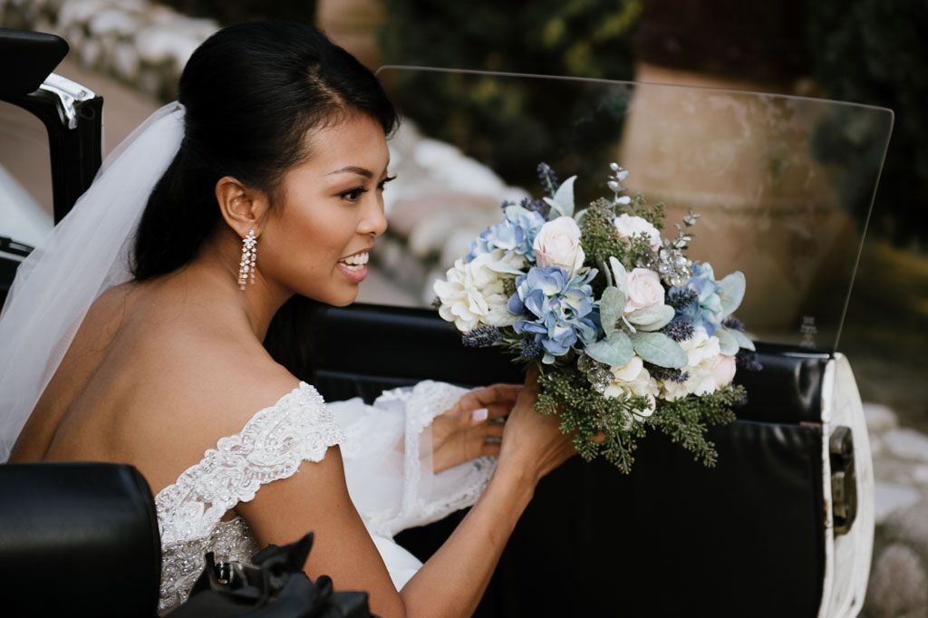 Wedding photography captures intimate moments in a lush garden setting.