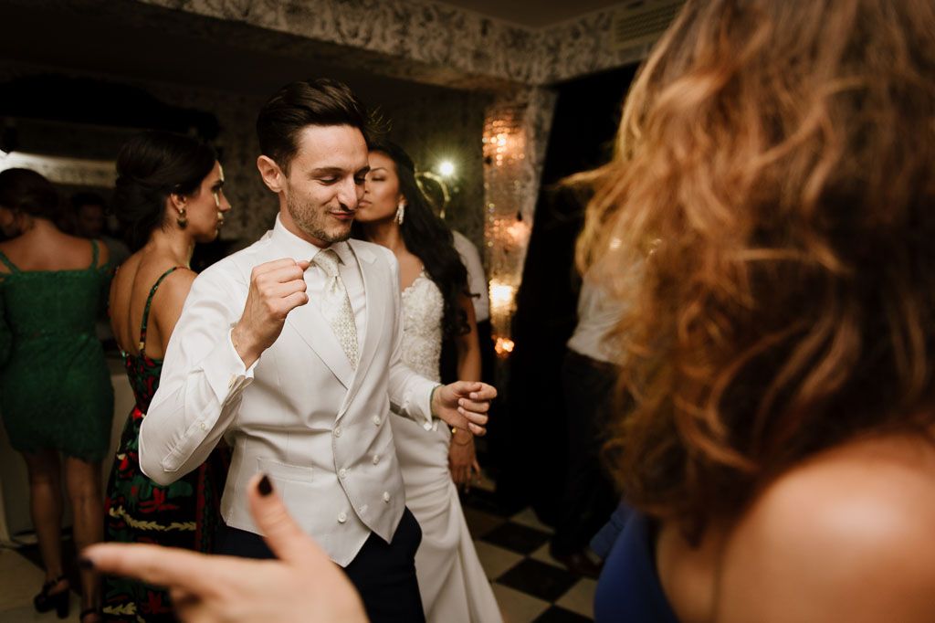 Elegant wedding reception dance scene with guests enjoying an evening celebration.