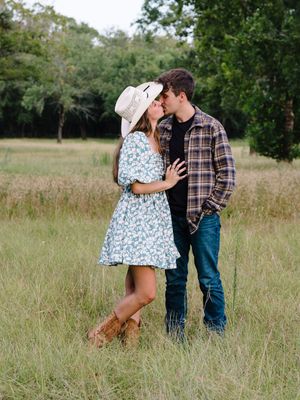 A couple shares tender moments in a natural field setting, shown in a sequence of romantic engagement photos.