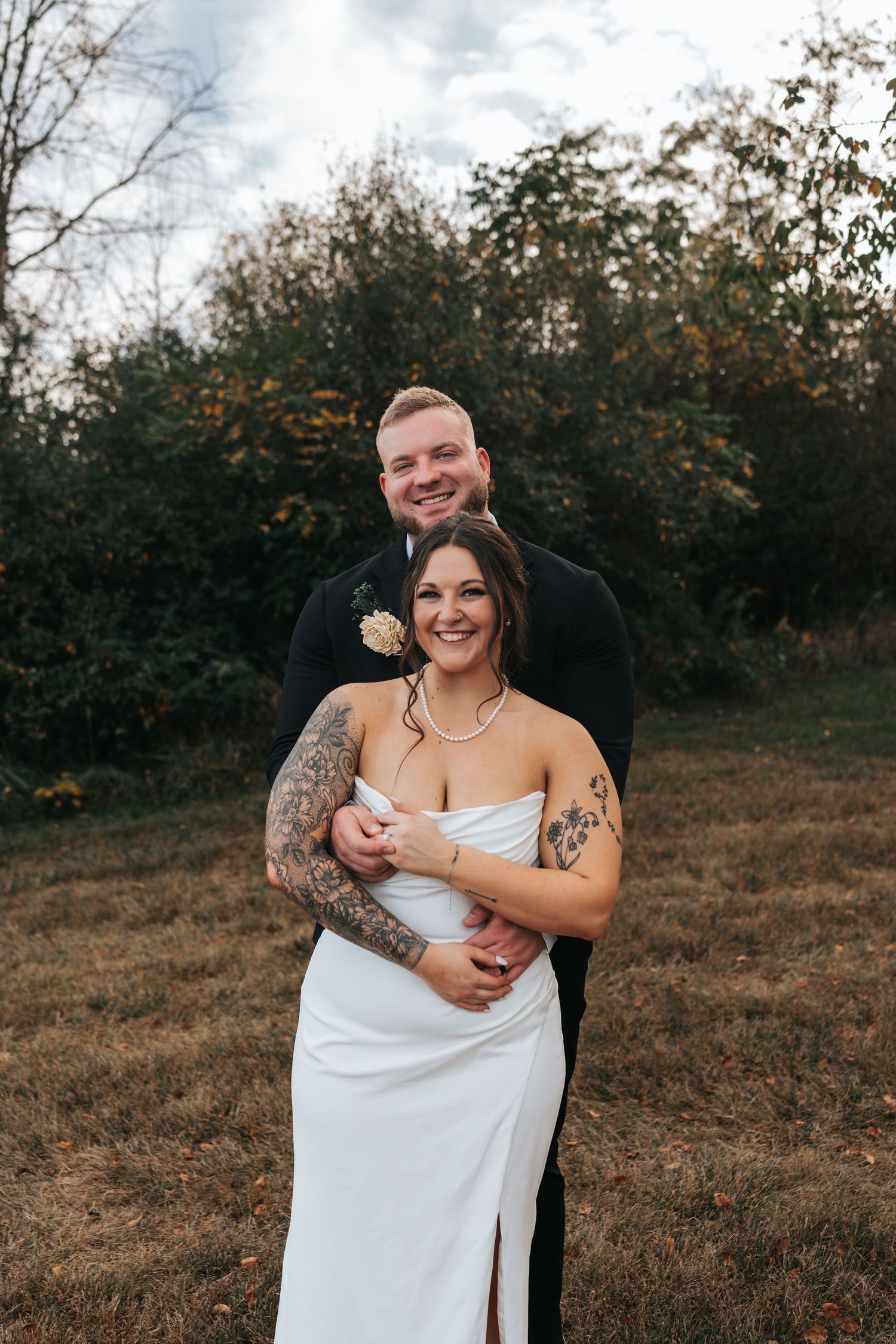 A romantic wedding kiss sequence with the couple in beige and white attire against a soft ethereal backdrop.