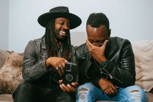Candid lifestyle photography session with natural laughter and relaxed poses.