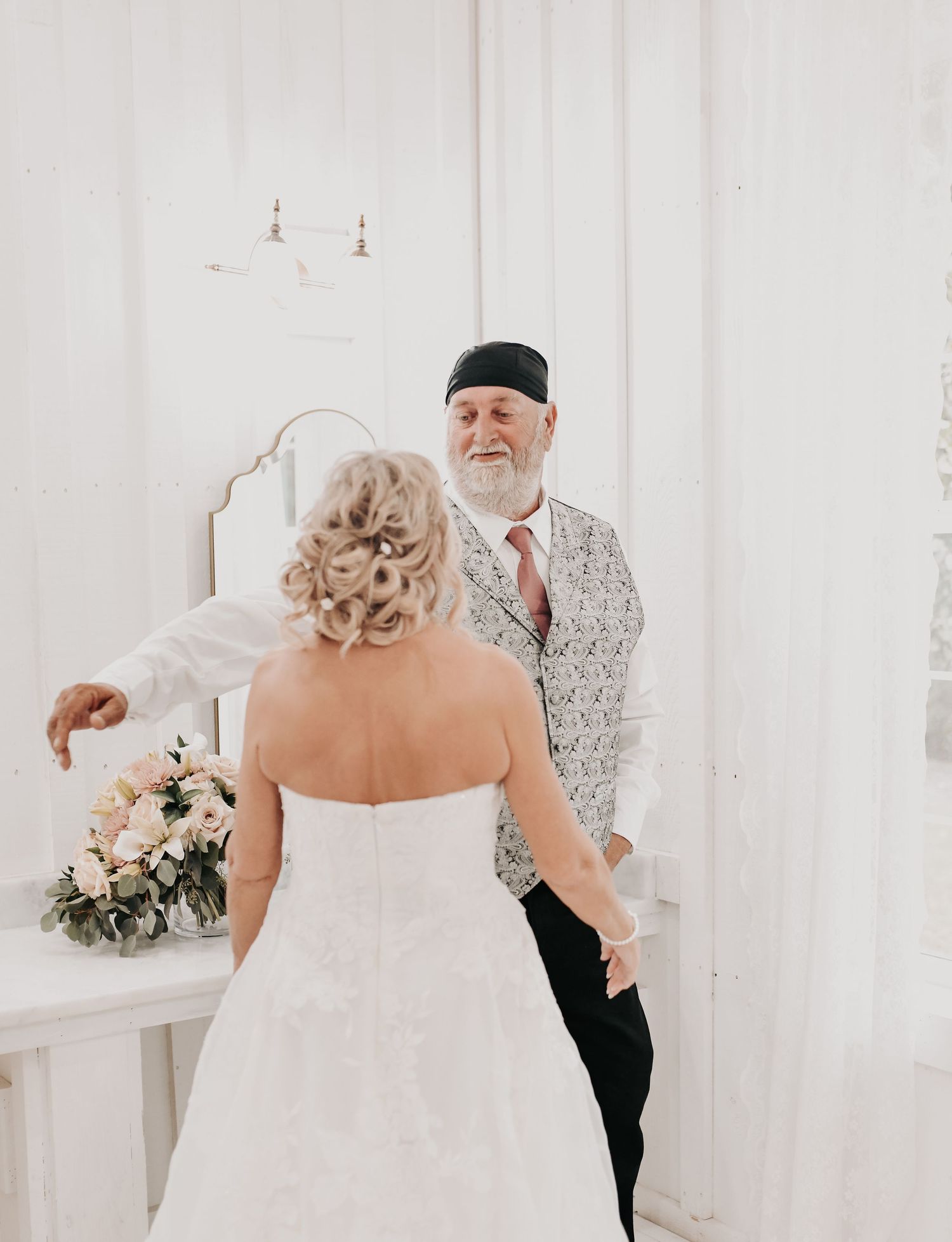 a bride and her brother have a first look before he walks her down the aisle