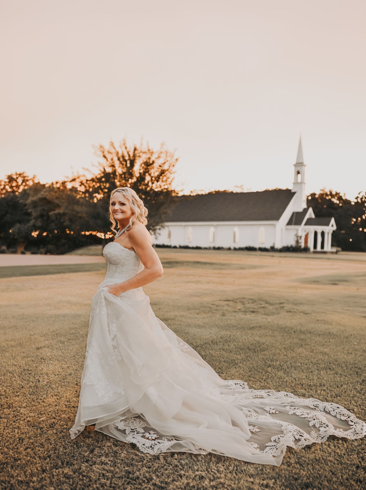 Bride walking across the lawn at The White Sparrow during their fall wedding