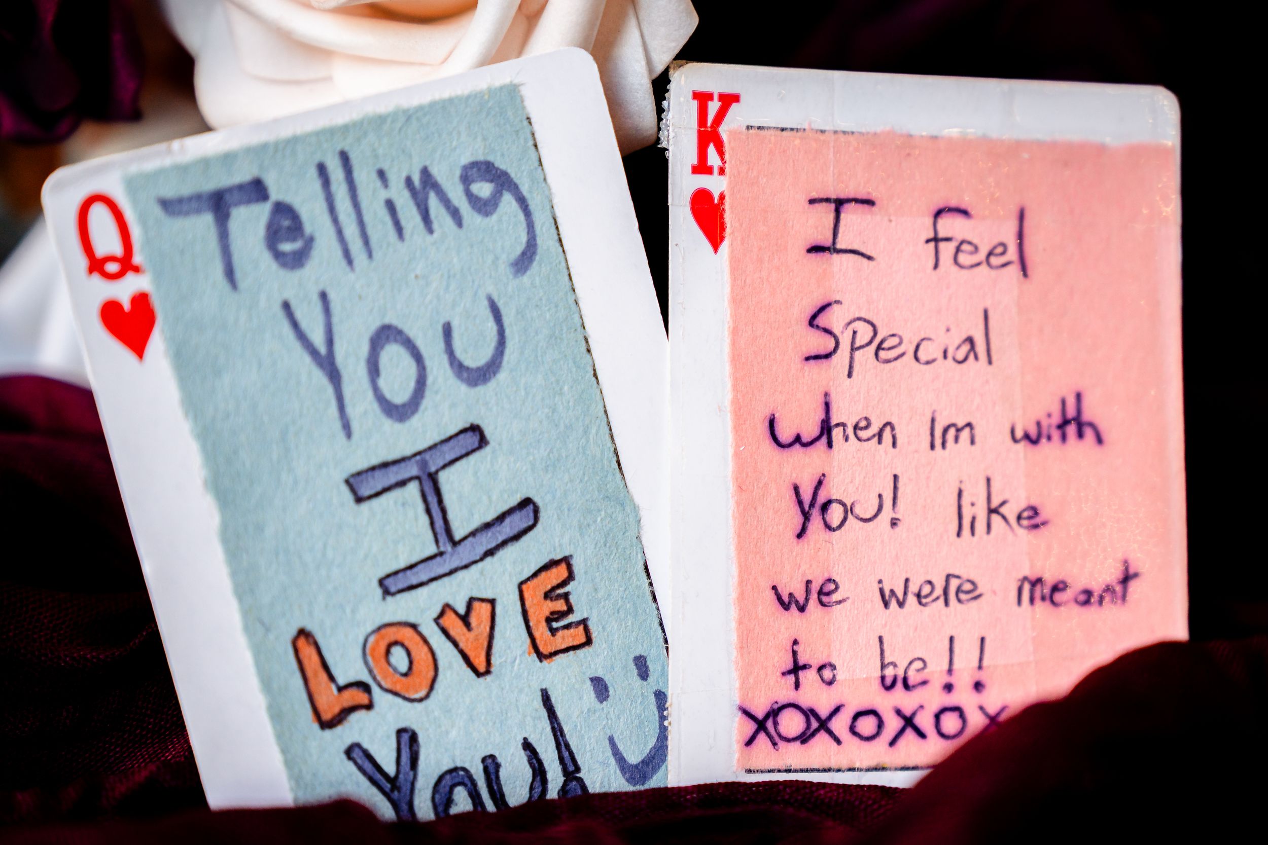 Two playing cards with handwritten love notes reading I Love You and I Feel Special When Im With You displayed together.