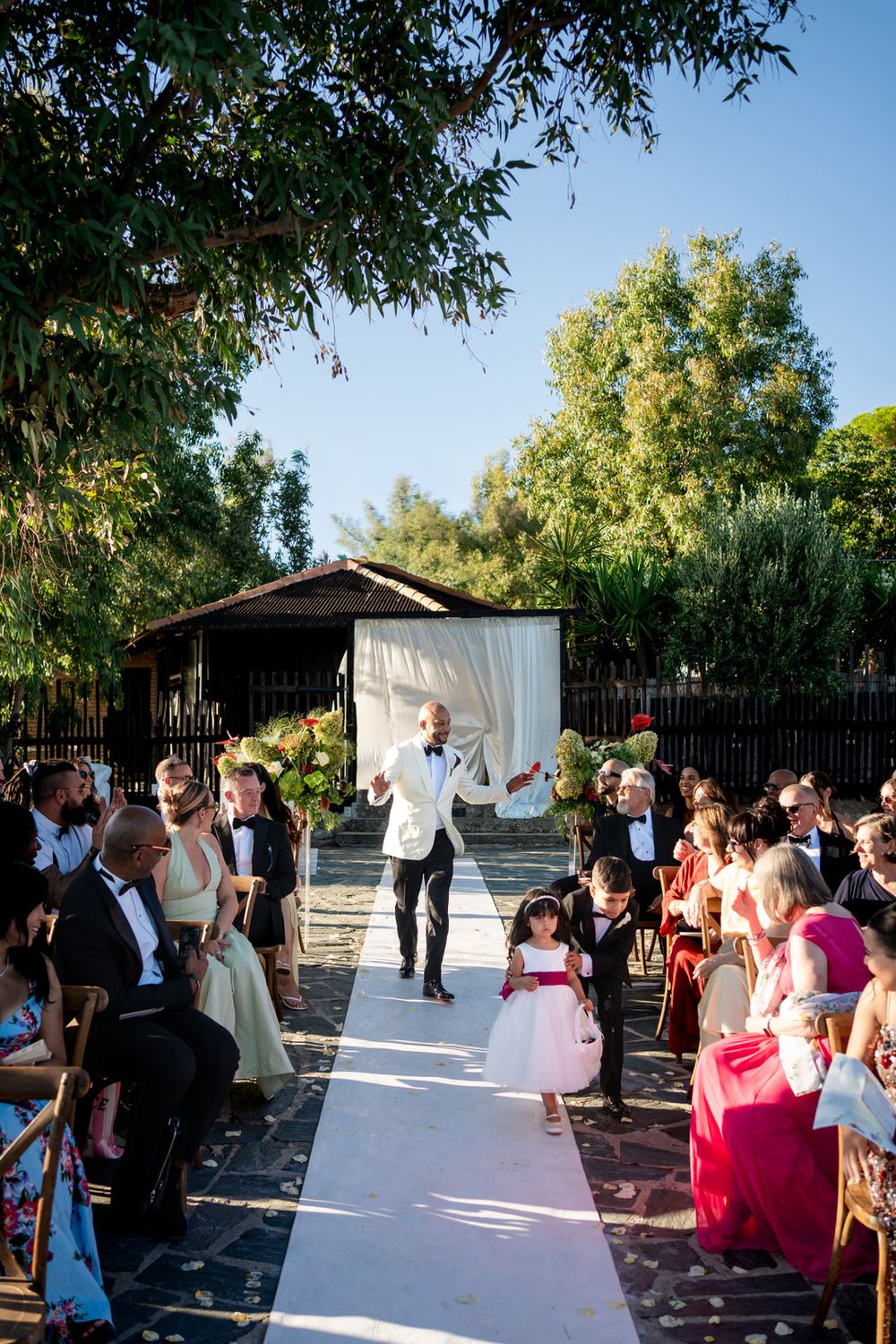 Bride and groom celebrating with guests after their wedding ceremony in Calabria