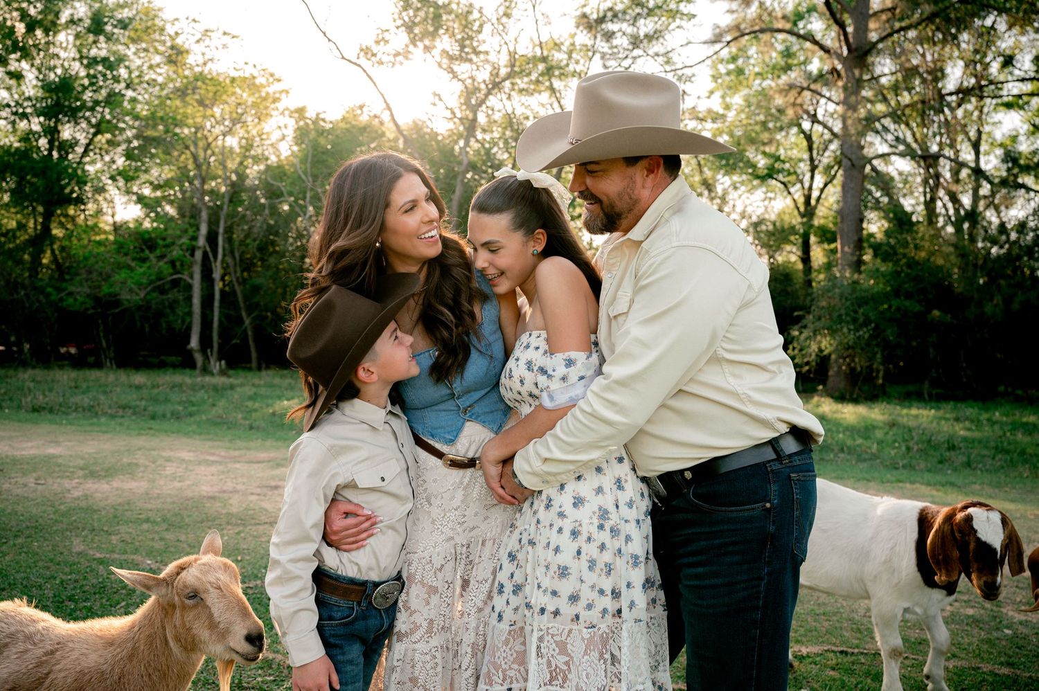 Parents sharing a candid moment together during their western-inspired family session at Good Vibes Farm.