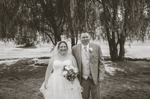 a bride and groom posing next to each other after their wedding day