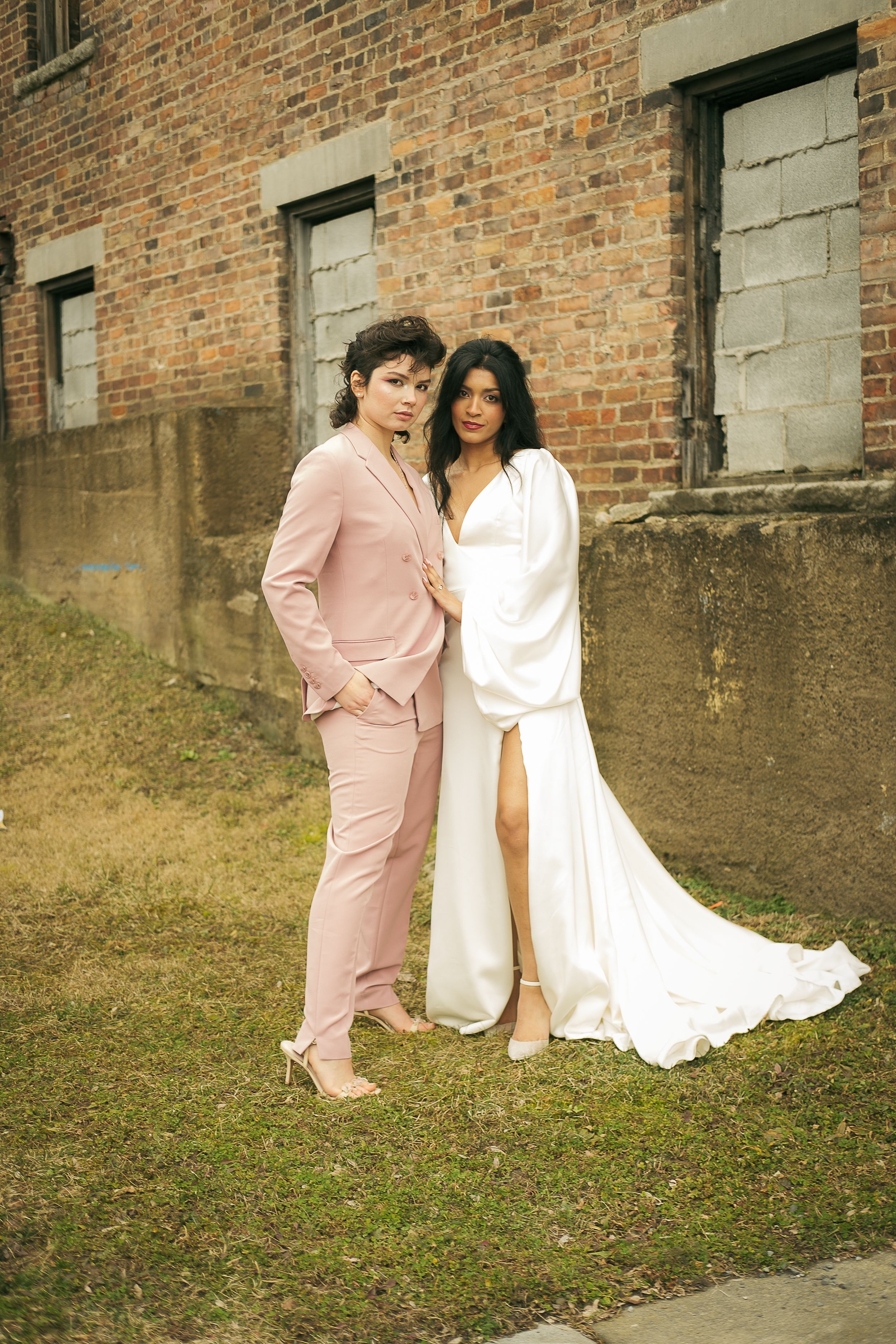 a young queer couple recently married standing side by side