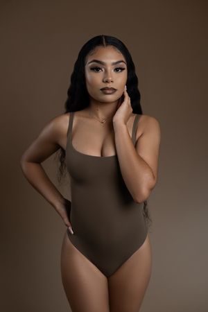 Professional beauty portrait featuring bronzed glam makeup and flawless skin.