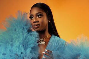 Editorial beauty portrait featuring vibrant colors, dramatic styling, and professional makeup artistry.