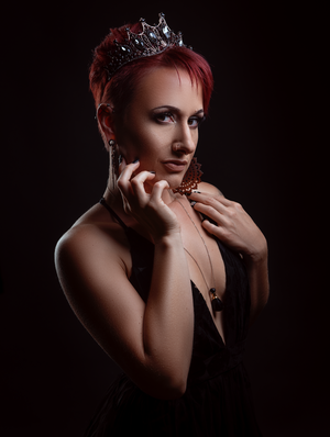 Creative studio portrait featuring dramatic beauty makeup and artistic lighting techniques.