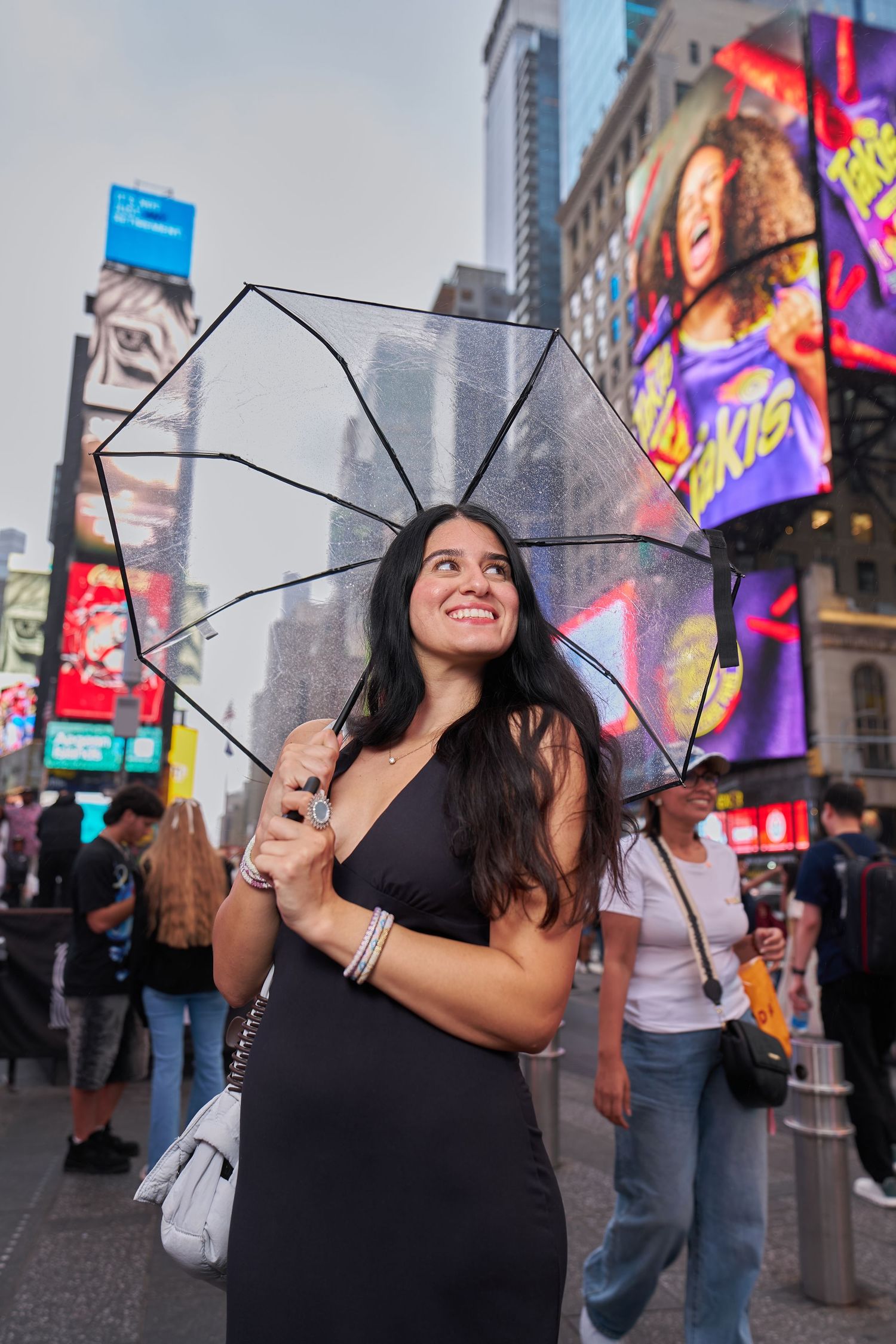 tourist with umbrella at times square