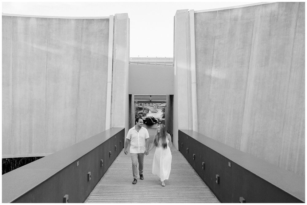 Couple walking hand in hand during a family photo session at Dreams Bahia Mita, celebrating their anniversary together.