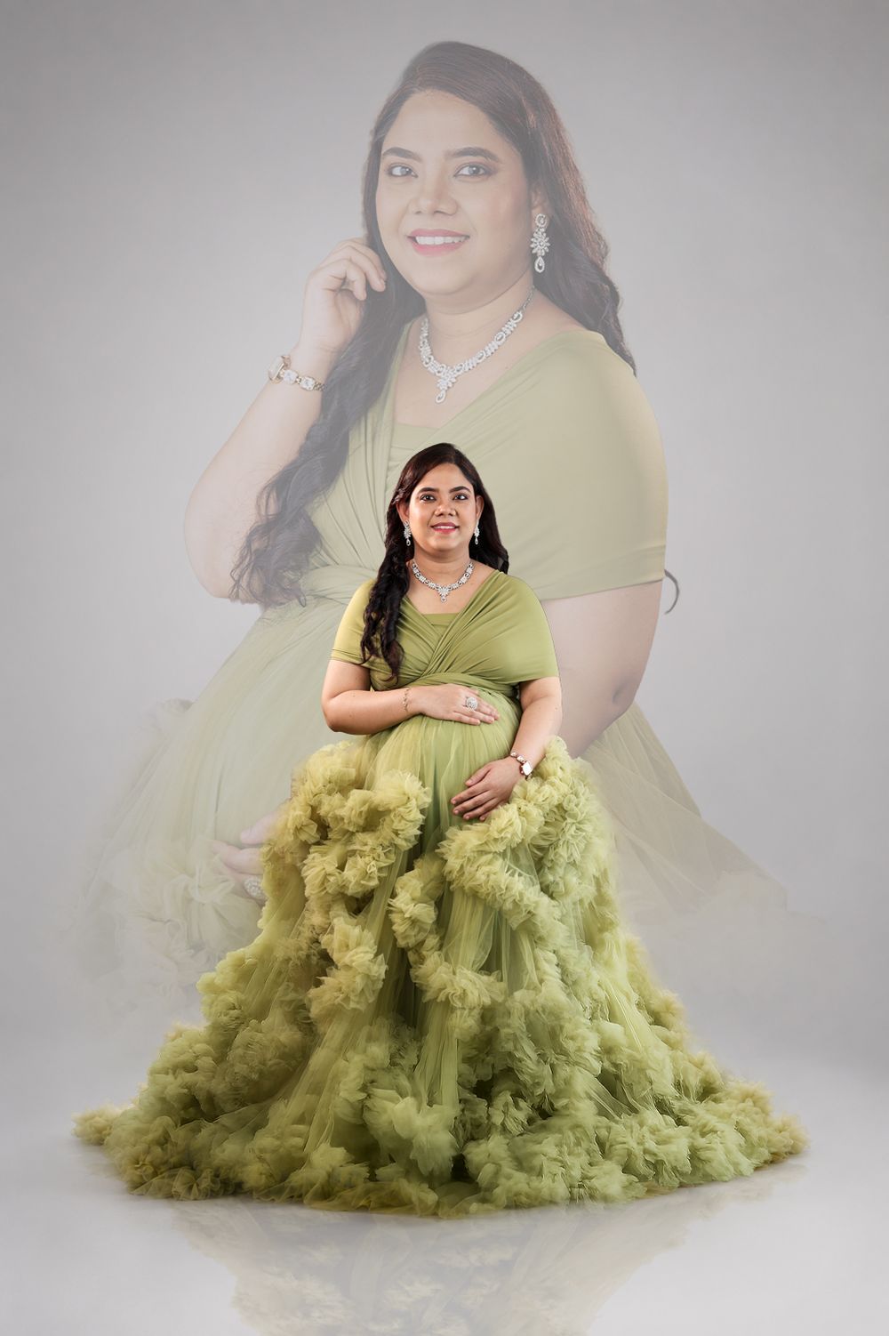 Pregnant woman in elegant olive green ruffled tulle maternity gown poses gracefully in studio with ghost image backdrop.