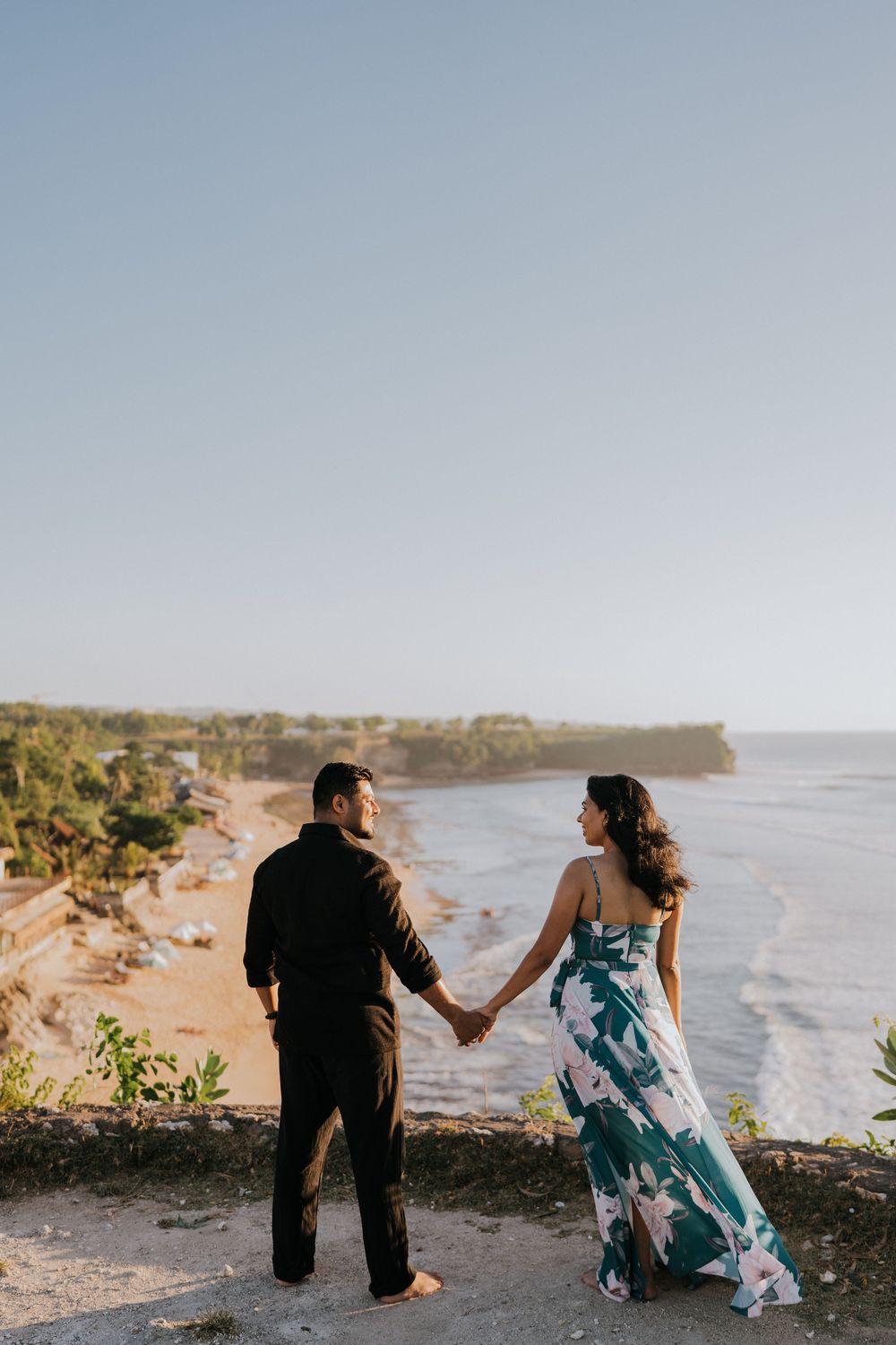 Romantic couple photoshoot at Balangan Beach Bali during golden hour.