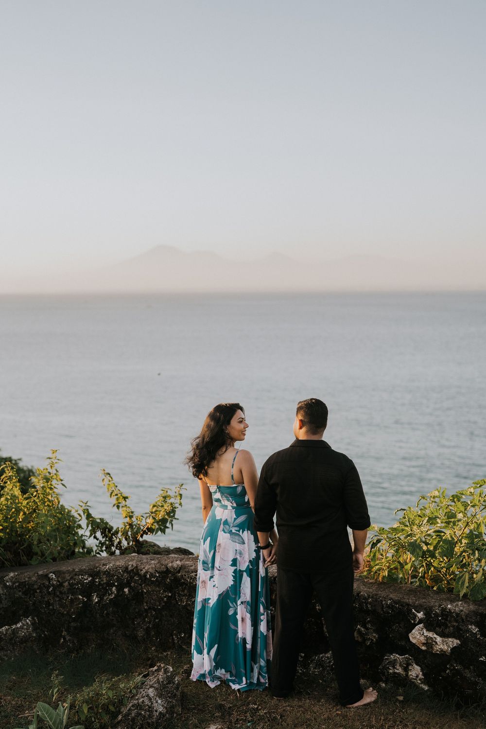 Romantic couple photoshoot at Balangan Beach Bali during golden hour.