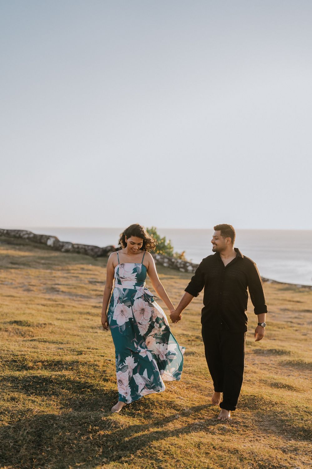 Romantic couple photoshoot at Balangan Beach Bali during golden hour.