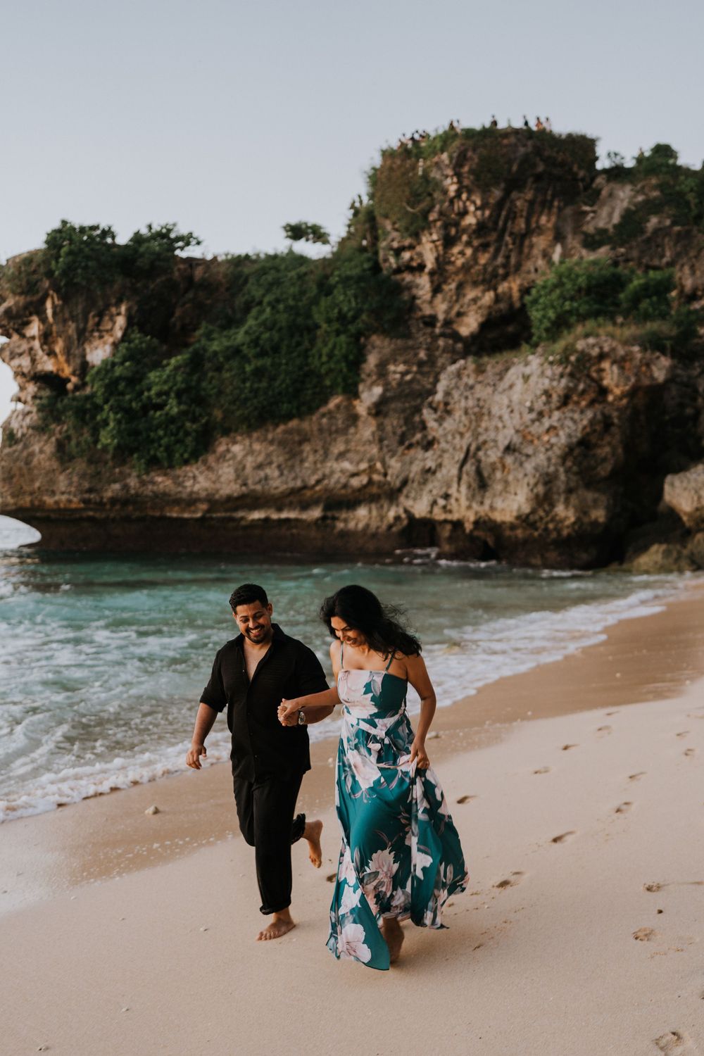 Romantic couple photoshoot at Balangan Beach Bali during golden hour.